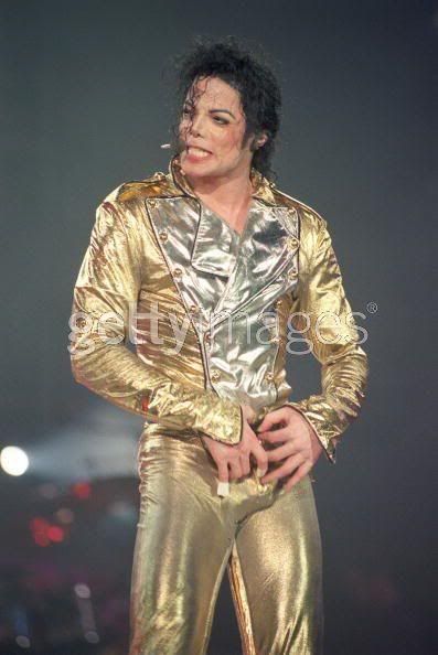 gold pants black shirt